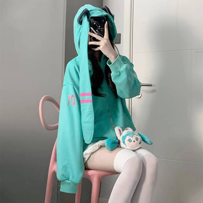 A-lovely-girl-sitting-chair-and-wearing-Hatsune-Miku-Long-Turquoise-Twintails-Hat-Full-Zip-Coat-and-put-a-hatsune-miku-stuffed-toy-on-head