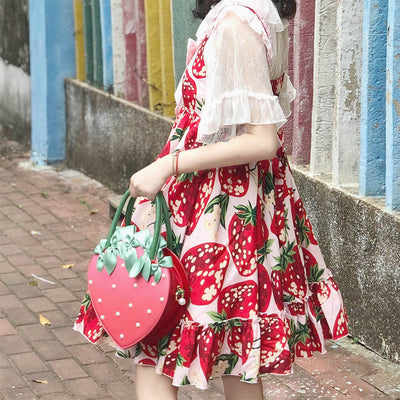 A-Girl-Wearing-Strawberry-Print-Dress-And-Hold-A-Strawberry-Shaped-Bag