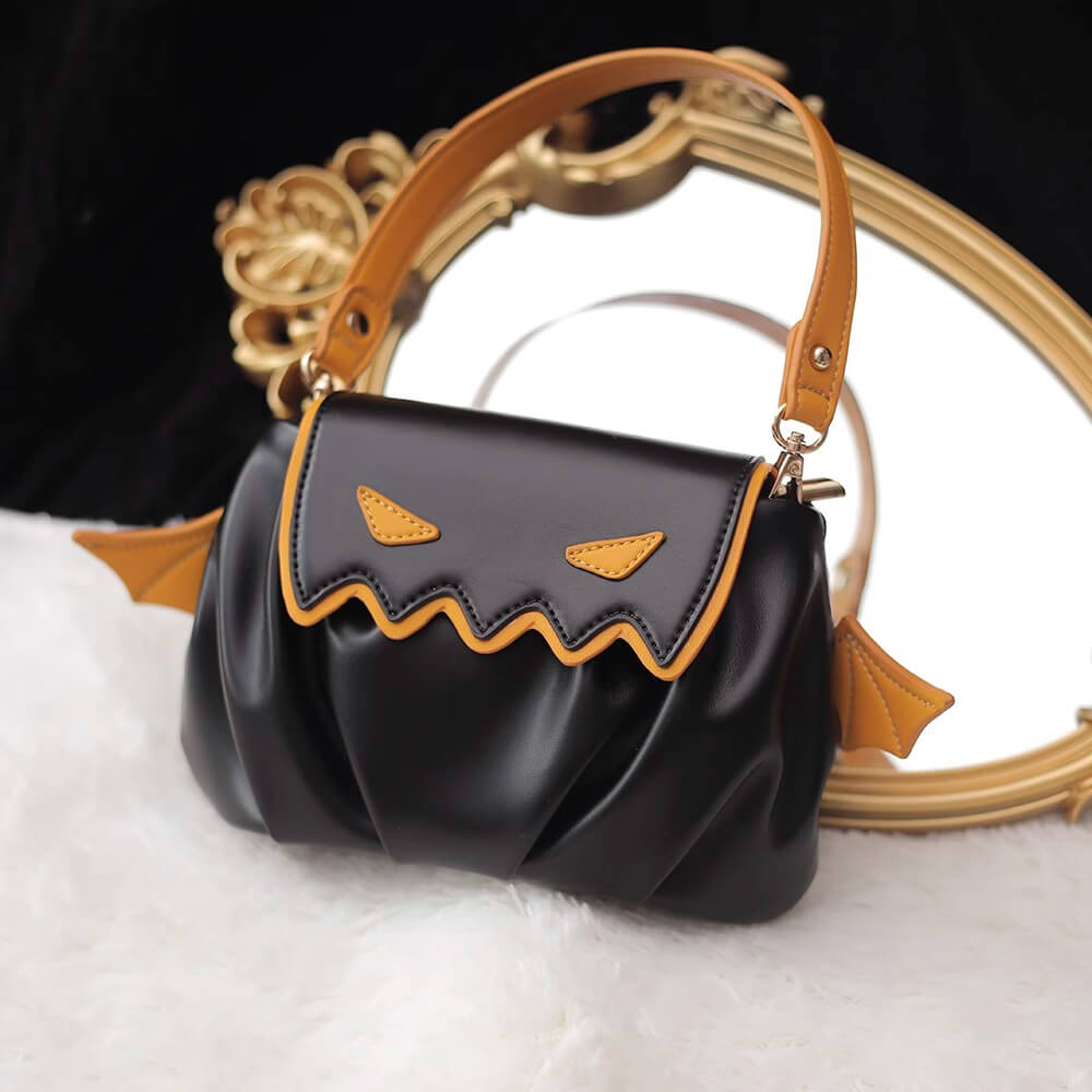Black_PU_Handbag_With_Orange_Little_Devil_Expression_And_Orange_Wings_Decoration