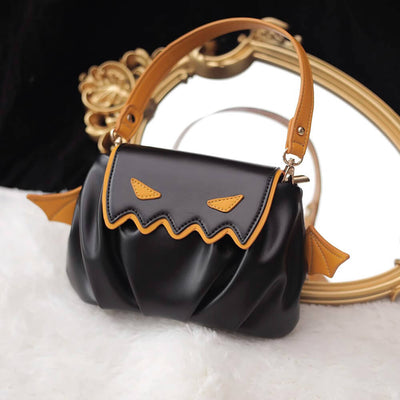 Black_PU_Handbag_With_Orange_Little_Devil_Expression_And_Orange_Wings_Decoration