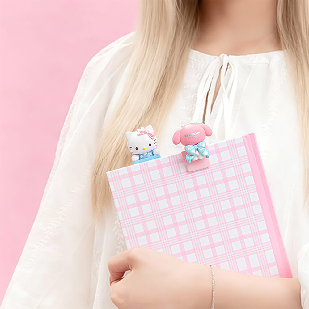 Bow-Sweet-Sanrio-Characters-Lying-Down-on-A-Book