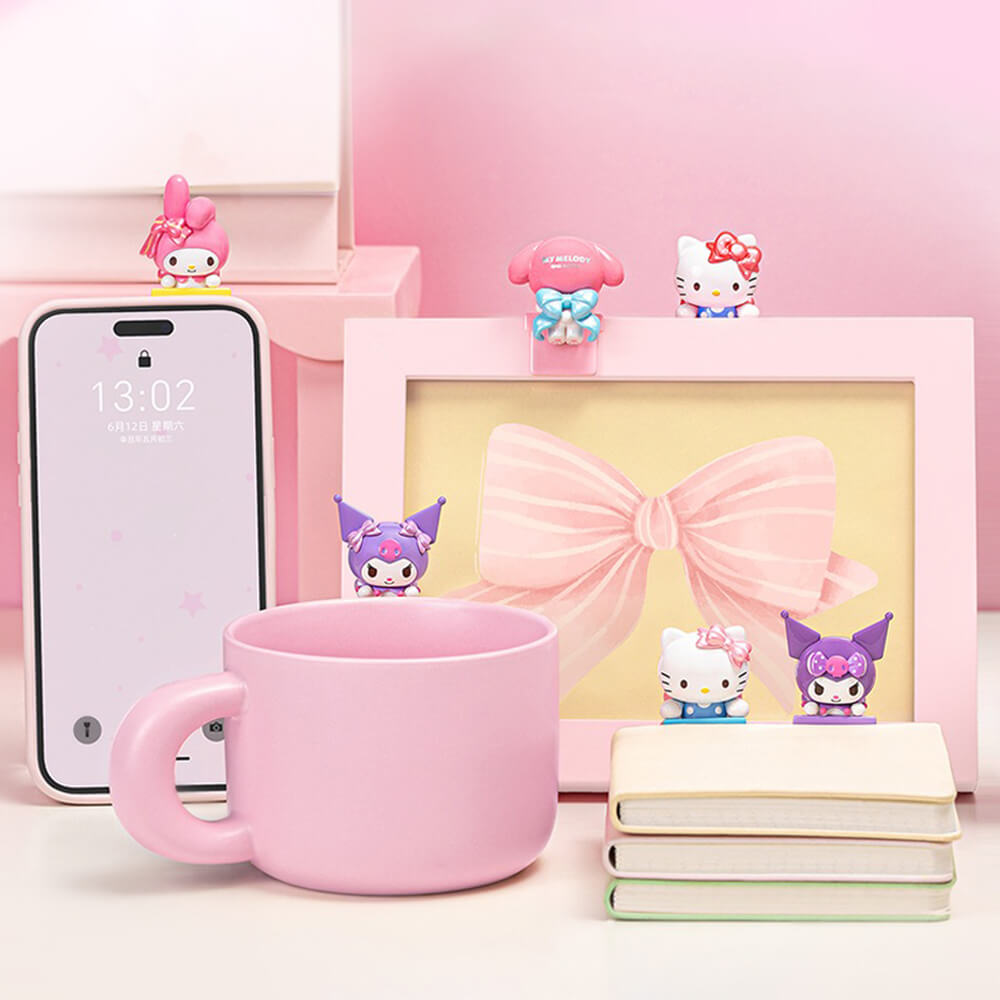 Bow-Sweet-Sanrio-Characters-Lying-Down-on-Mug-on-Phone-on-Book