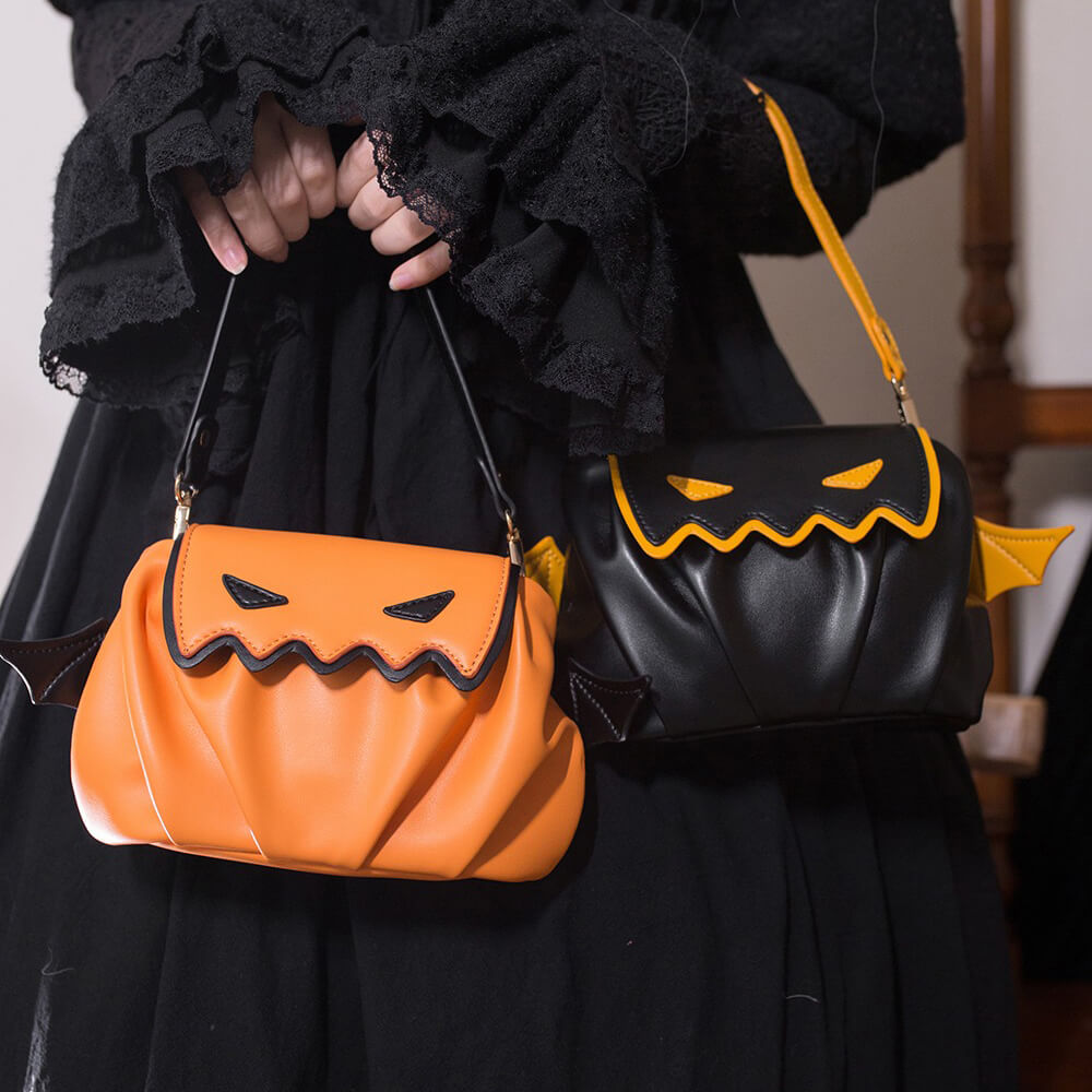 Lolita-Model-Holding-Two-Little-Devil-Handbags-In-Hand-Black-And-Orange