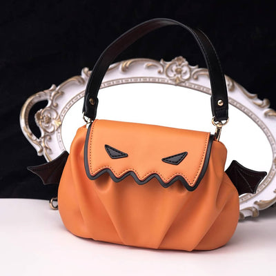 Pumpkin_Orange_PU_Handbag_With_Black_Little_Devil_Expression_And_Black_Wings_Decoration