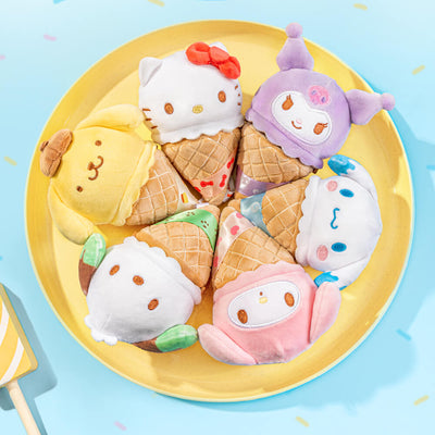 Sanrio Character plush toys shaped like ice cream cones and buns on a yellow plate with a blue background