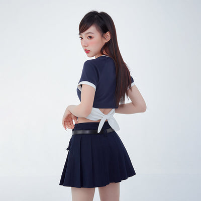 backside-display-of-cinnamoroll-high-waisted-pleated-mini-skirt-decorated-with-ribbon-bows-in-navy-blue