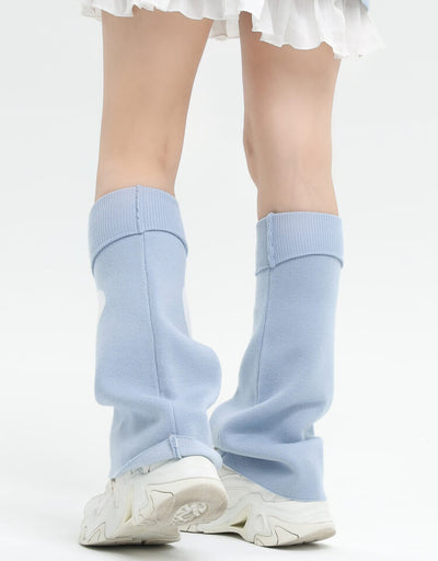 backside-display-of-the-y2k-cross-heart-graphic-leg-warmers-in-blue