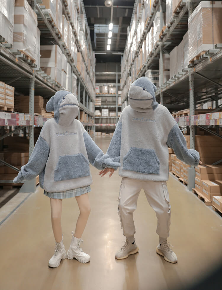 couple-wearing-shark-fleece-hoodies-at-warehouse