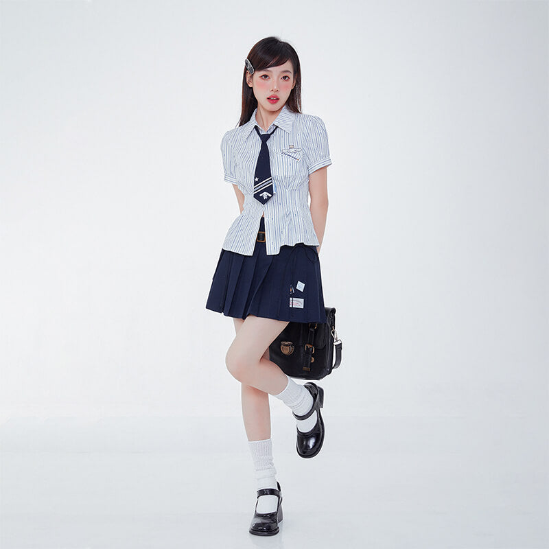 japanese-girl-fashion-outfit-with-blue-white-striped-cinnamoroll-shirt-and-navy-pleated-mini-skirt-and-messenger-bag