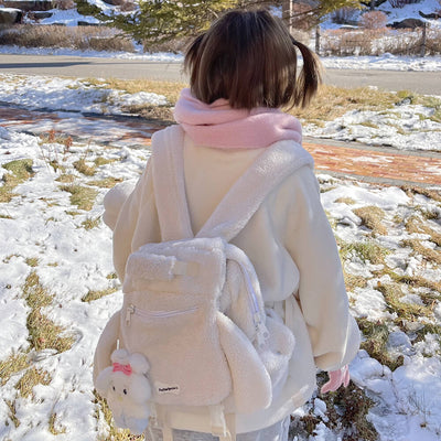 kawaii-girl-wearing-white-puppy-ears-backpack-in-the-snow