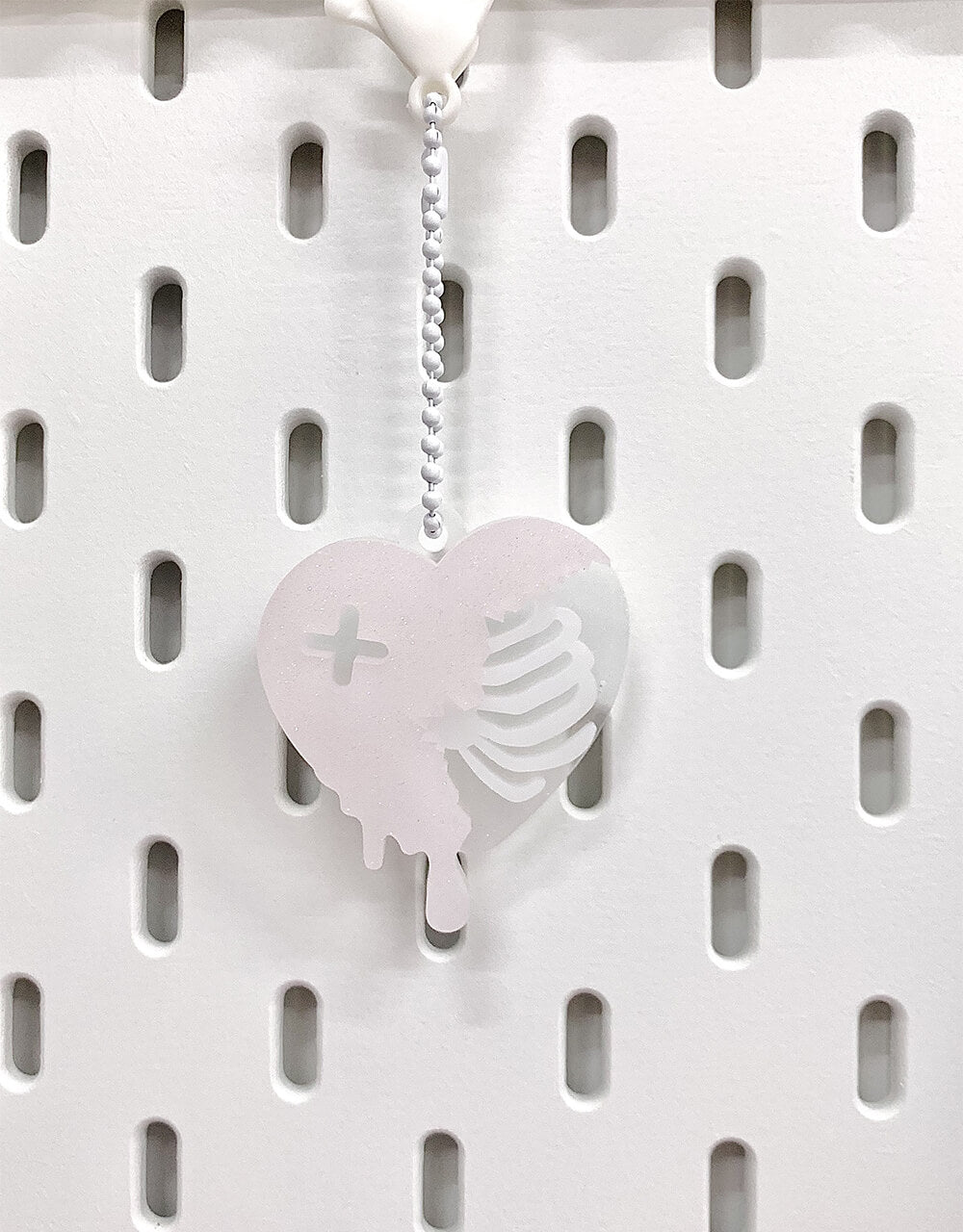 pink-white-Rib-Cage-Heart-Resin-Charm-Keychain-hang-on-pegboard