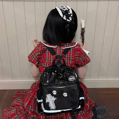 red-plaid-dress-look-styled-by-the-black-pu-ita-backpack-bag