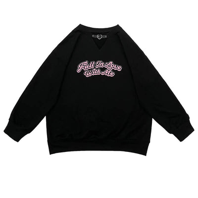white-background-display-of-the-pink-letters-black-oversize-sweatshirt